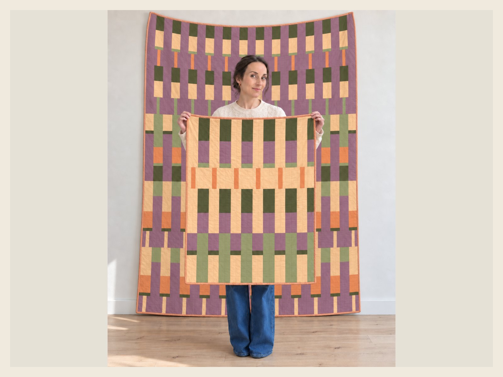 The Lineage quilt in Mauve Meadow held up, with the Baby size layered in front of it at the same scale.