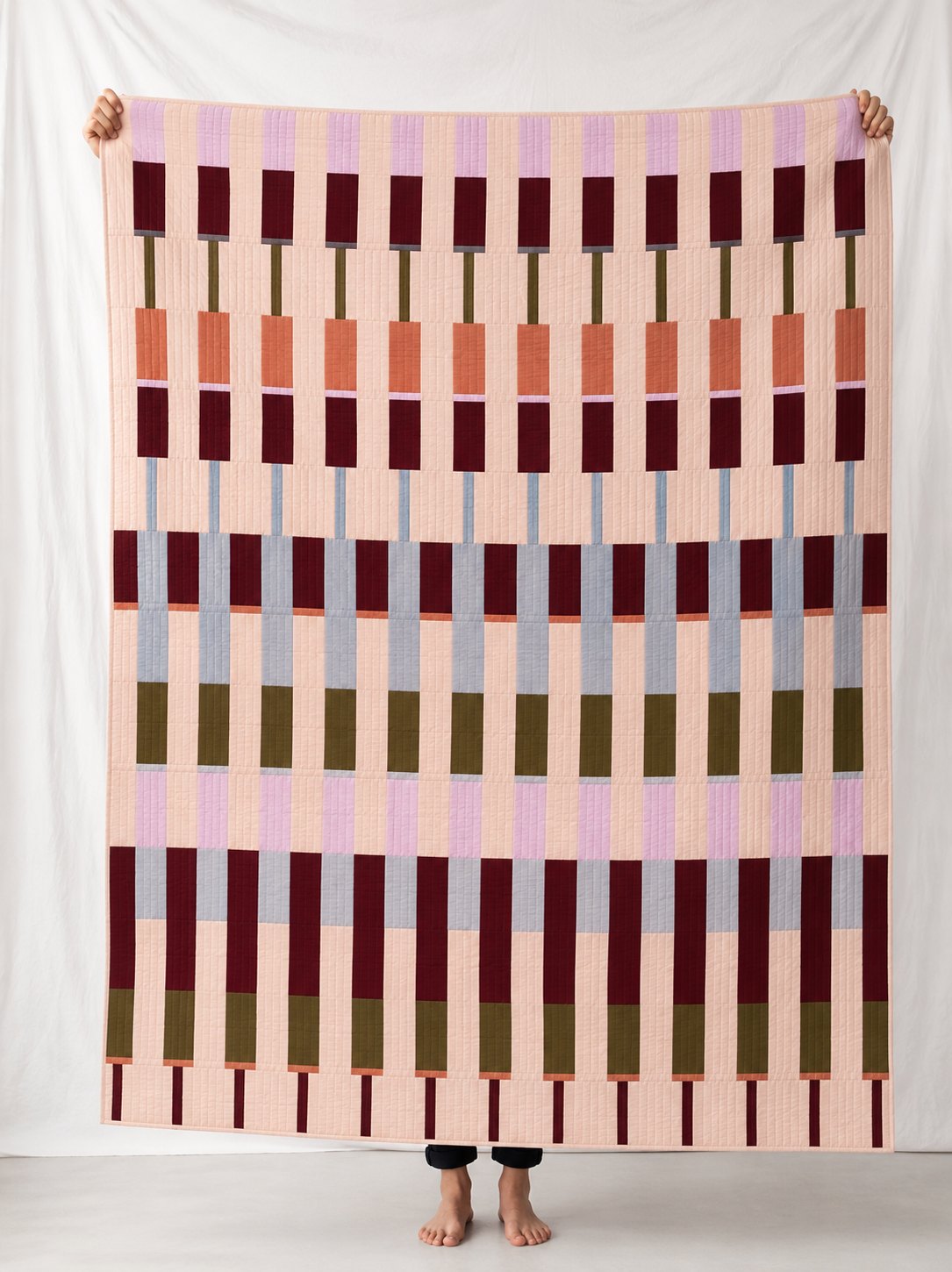 Lineage in the GRASSLANDS colourway, digitally rendered in a room.